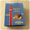 قیمت خرید و فروش ویفر نستله با روکش شکلاتی و فندق بوداده مدل 1927 بسته 12 عددی